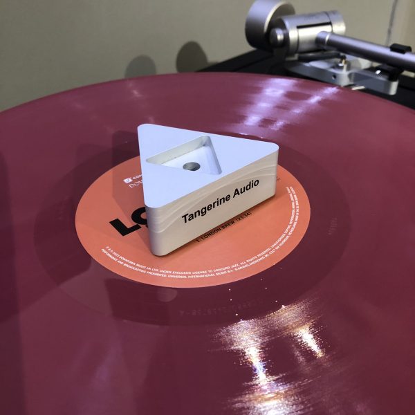 Tangerine Audio Evenstar disc Stabiliser placed on red vinyl, playing on linn lp12 turntable, at loud and clear glasgow, scotland, uk