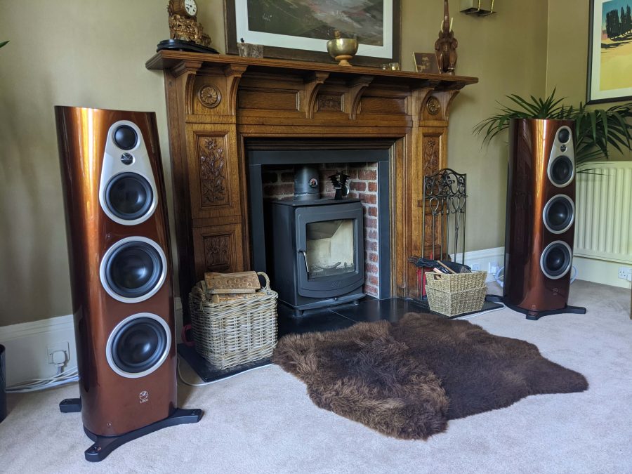 Linn 360 active speakers in single malt finish in beautiful living room with wood burning stove, high-end audio from loud and clear hi-fi, glasgow, scotland, uk