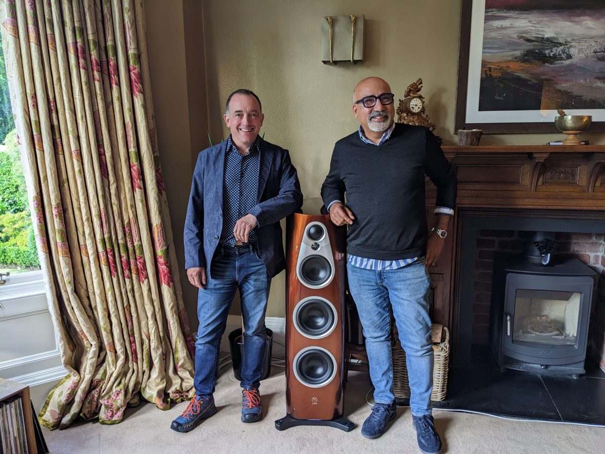 Gilad Tiefenbrun and man standing beside Linn 360 speakers in dem room of high-end audio retailer Loud and Clear hi-fi, glasgow, scotland, uk