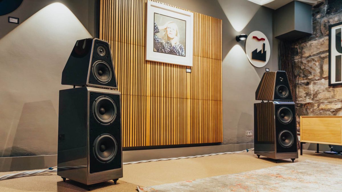 Wilson Audio The WATT Puppy floorstanding speakers in galaxy gray finish in loud and clear glasgow demonstration room with artnovion room treatment and david bowie artwork on wall, high end stereo equipment from one the uk's best hi-fi shops