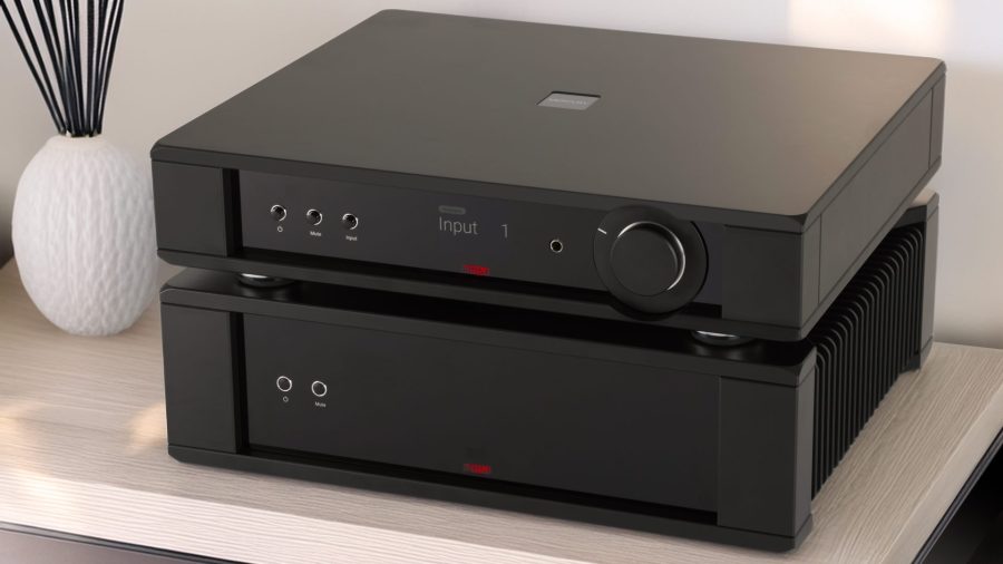 Rega Mercury preamplifier and Solis power amplifier sitting on top of each other with a white vase beside them on a light wooden shelf, high-end hi-fi from loud and clear glasgow, scotland, uk