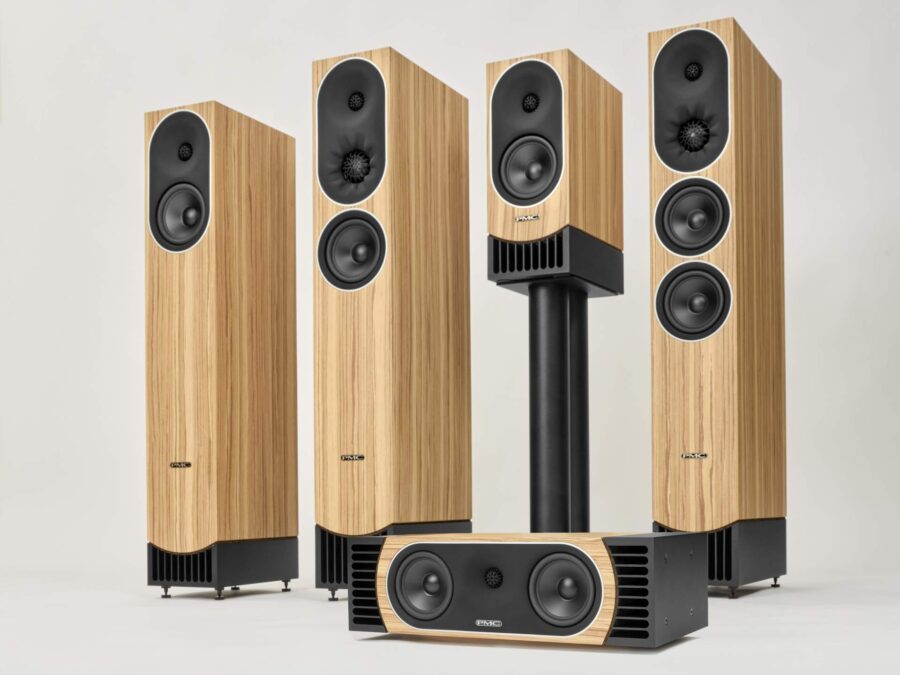PMC Prophecy speakers in mediterranean Oak Group shot with three floorstanding and one stand mount speaker plus centre channel with plain background, hi-fi and home cinema from loud and clear glasgow, scotland, uk