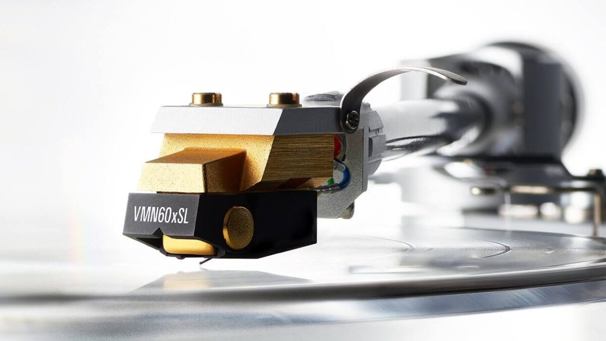 hero shot of the new audio-technica vm760xsl cartridge mounted on headshell with finger lift and turntable tonearm whilst playing a vinyl record, hi-fi from loud and clear glasgow, scotland, uk